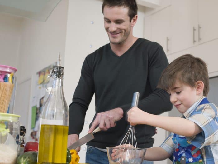 Father baking with his son in the kitchen